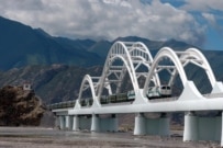 A train crosses a bridge outside of Lhasa on the new railway (epa)