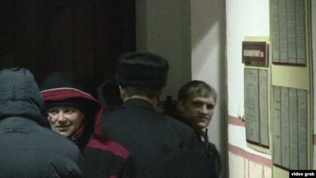 Syarhey Kavalenka (right) as he was escorted into the Vitebsk courtroom on February 24