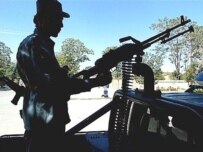 An Afghan police officer on patrol in Ghazni Province (file photo) (AFP)