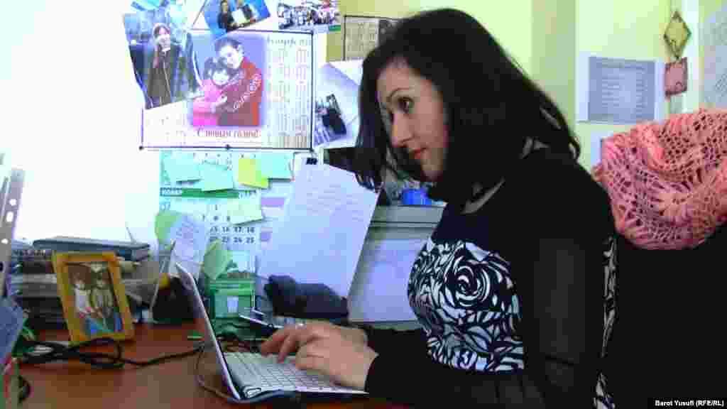 Komilzoda working in her office in Dushanbe