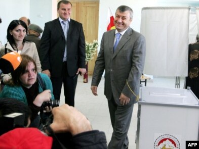 South Ossetian leader Eduard Kokoity addresses reporters at a polling station.