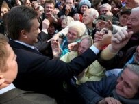 Yanukovych (left) meeting with supporters in Kyiv on April 3 (AFP)