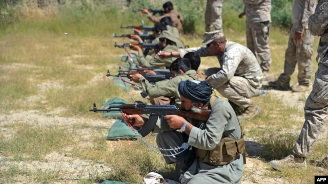 U.S. Marines conduct a training session for Afghan local police in Helmand Province. The United States and its NATO partners are racing against the clock to train Afghanistan's 350,000-strong security forces.
