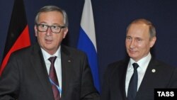 Глава Еврокомиссии Жан-Клод Юнкер (слева) и президент России Владимир Путин. Иллюстративное фото.