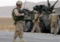 Canadian troops secure the site of a suicide attack in Kandahar in early March (file photo) (epa)