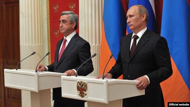 Russian President Vladimir Putin (right) and his Armenian counterpart, Serzh Sarkisian, aaddress a joint news conference after talks in the Kremlin on August 8.