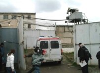 An ambulance enters the prison compound on March 27