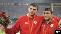 Belarusian silver medalist Vadim Devyatovskiy (left) and bronze medalist Ivan Tsikhan in Beijing
