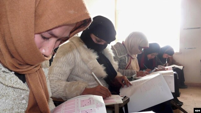 Afghan girls take a university admission test in Kunduz. Women now make up 30 percent of university students in Afghanistan