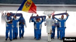 "Hey, I know that tune...sort of." The Moldovan national team enters Fisht Stadium for the opening ceremony of the 2014 Sochi Winter Olympics on February 7.