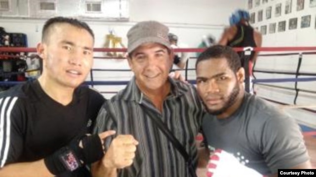 Qanat Islam (left), his manager Nelson Lopez (center), and Olympic gold medalist Felix Diaz in Miami