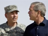 U.S. President George W. Bush speaks with General David Petraeus during Bush's visit to Iraq on September 3 (AFP)