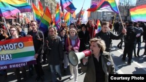 Natalya Tsymbalova (right foreground) leads a march by the Alliance of Heterosexuals for LGBT Equality in St. Petersburg.