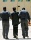 Iraq -- Saddam Hussein being led away from a court hearing, 01Jul2004