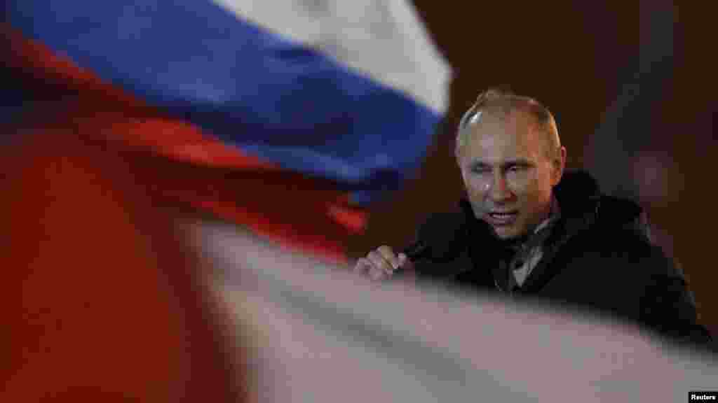 Russian Prime Minister Vladimir Putin addresses his supporters with tears in his eyes on Manezhnaya Square in Moscow on March 4. Putin won a resounding victory in Russia's presidential election, securing a new six-year term in the Kremlin and a mandate to deal with opposition protests after a vote that opponents said was marred by fraud. (Reuters/Denis Sinyakov)