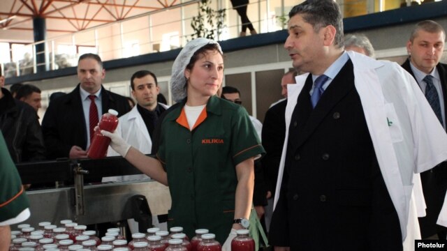 Armenia - Prime Minister Tigran Sarkisian (R) visits a beverage plant in Yerevan, 4Feb2013.