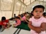 Local children play inside a tent on the outskirts of Osh in late August.