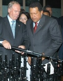 Venezuelan President Hugo Chavez (right) inspects Kalashnikov assault rifles during his July visit to Russia (AFP)