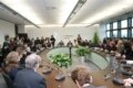 Former Czech President Vaclav Havel presides over the first official editorial meeting at the new headquarters, 2009.