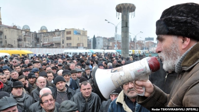 Striking "marshrutka" drivers gathered in front of their vehicles in the Georgian capital, Tbilisi, to protest on February 25.