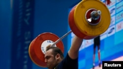 Iran's Behdad Salimikordasiabi set a record but was unable to complete a weightlifting competition in Rio, losing to Georgia's Talakhadze.
