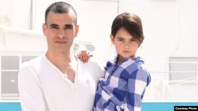 Ronny Edry poses with his daughter as part of his "Israel-Loves-Iran" Facebook initiative.