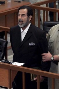 Saddam Hussein listens as the death penality is handed down against him on November 5 (epa)