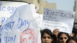Indian lawyers shout slogans as they hold placards during a protest at the entrance to Saket District Court in New Delhi earlier this month.