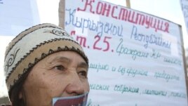 Aziza Abdyrasulova during a November 2007 protest in Bishkek against attempts by the government to limit free speech and the right of free assembly. She glued her mouth shut with the epaulet from a police officer's uniform.