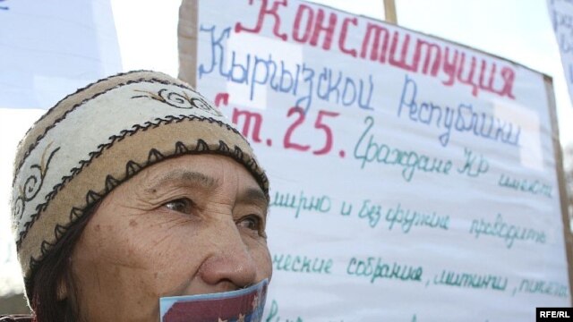 Aziza Abdyrasulova during a November 2007 protest in Bishkek against attempts by the government to limit free speech and the right of free assembly. She glued her mouth shut with the epaulet from a police officer's uniform.