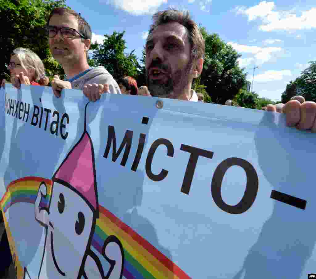 A delgation from Munich, including the city's mayor, attended the march "as an act of solidarity." Their placard says "Munich greets Kyiv."