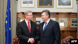 The European Union's enlargement commissioner, Stefan Fuele (left), pictured here with President Viktor Yanukovych in September.