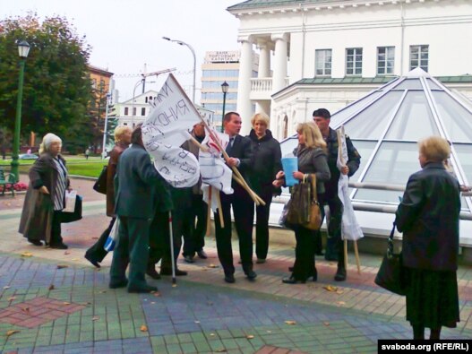 Officials disperse prisoners' mothers who were staging a protest on Minsk's Liberty Square.