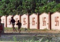 Hindu swastikas on a wall in India (AFP)