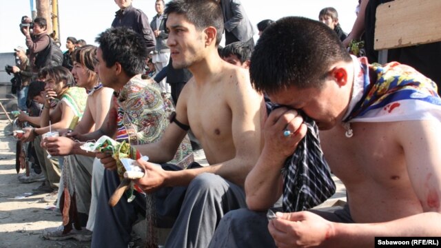 Afghan Shi'ite Muslims beat themselves with chains and blades to mark Ashura at a shrine in Kabul.