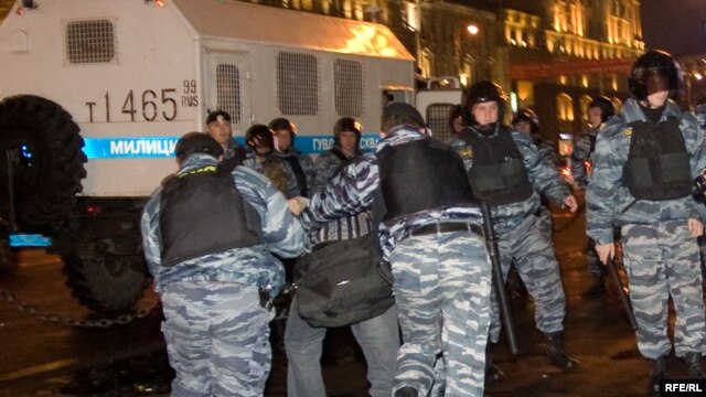 Riot police, with a shiny new truck, breaking up a demonstration against election falsification in Moscow in October.