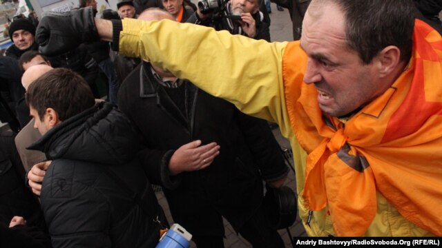 One of the opposition supporters who gathered to celebrate Freedom Day on Independence Square in Kyiv on November 22.
