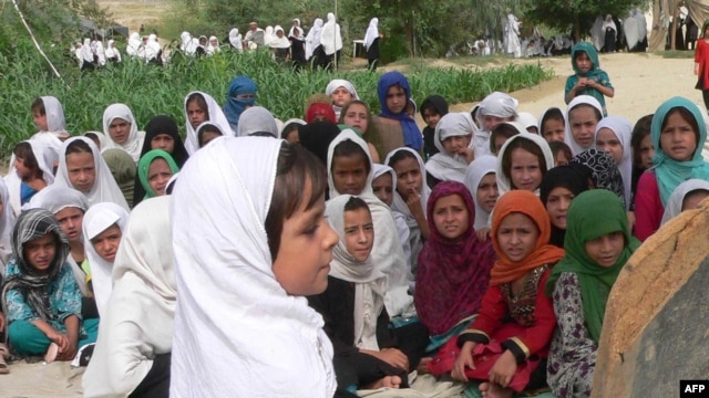 Schoolgirls study in an open air school in the outskirts of Jalalabad, Afghanistan, 11Sep2012