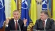 Ukrainian President Petro Poroshenko (right) listens to NATO General-Secretary Jens Stoltenberg in Kyiv in September 2015. The stripped-down July 13 meeting will be only the council's second since it resumed functioning in April after NATO suspended it in 2014 over Russia's occupation of Ukraine's Crimea region.