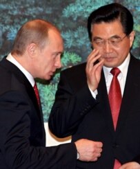 Russian President Vladimir Putin (left) pictured with Chinese President Hu Jintao in Beijing on March 21