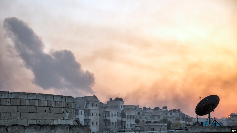 Smoke billows from the frontline district of Dahiyet al-Assad following an attack by rebels on Syrian regime forces in the northern city of Aleppo on October 29.