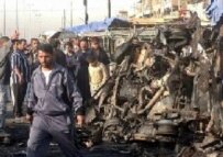 Iraqis at the scene of an attack in Al-Sadr city in east Baghdad on March 13 (epa)