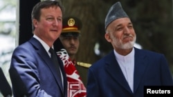 British Prime Minister David Cameron (left) and Afghan President Hamid Karzai (file photo)