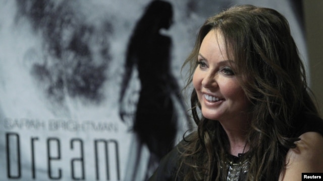 British entertainer Sarah Brightman smiles during an interview in Moscow on October 10, when she announced her plans to travel to the International Space Station aboard a Soyuz spacecraft.