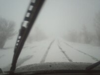 The wintry conditions, such as on this road in Baljuvan district, east of Dushanbe, are causing some Tajik bus drivers to charge passengers twice the price for tickets.