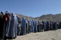 Afghan widows line up in Kabul in October to receive rations provided by international donors (epa)