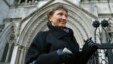 Aleksandr Litvinenko's widow, Marina, who has battled for a full public inquest into her husband's death, leaves the High Court in London in March.