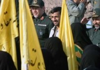 President Ahmadinejad (center) reviewing paramilitary volunteers in Tehran today (Fars)