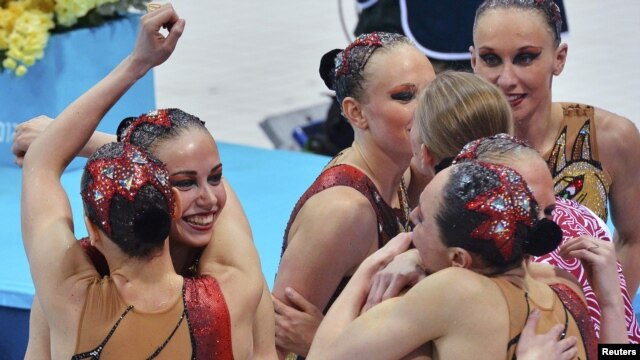 Russia's synchronized swimmers celebrate winning the gold medal.