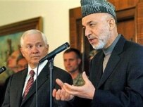 Gates (left) with Karzai in Kabul today (AFP)